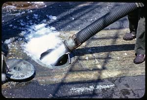 Filling boat hull with ice from a hose