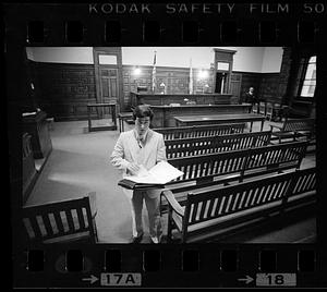 Suffolk Law School student in empty courtroom, Somerville, MA