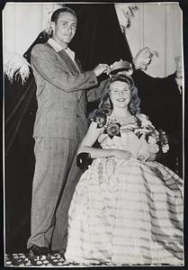 Taking Time Off from his baseball duties with the Boston Braves, Sibby Sisti crowns Mary Ann Regan "Queen of Hearts" during an affair of St. Anthony's High School at Fort Lauderdale, Fla.