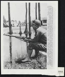 Almost a week after Hurricane Cleo brought her torrential rains to this South Georgia Army post, the parade field still was under a foot of water. So S/4C Phil Schaefer, doing his annual two week training stint with the 81st Infantry Division, mastered his environment by wetting a line -- the line, of course, being tied to his M-1 rifle.