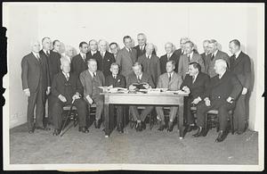 Attend National Baseball Meeting. Representatives of National League baseball clubs held their meeting in New York City December 9. Photo shows a group of the representatives. Left to right, seated: S.W. McKeever, Brooklyn; Charles A. Stoneham, New York; Barney Dreyfus, Pittsburgh; John A. Heydler, president of the National League; Sam Breadon, St. Louis; Judge Emil Fuchs, Boston; and John J. Tierney, New York. Standing: L.C. Widrig, Cincinnati; James J. Tierney, New York; S.W. Dreyfus, Pittsburgh; John O. Seys, Chicago; Leo Bondy, New York; James Mulvey, Brooklyn; F.B. York, Brooklyn; Sidney Weil, Cincinnati; W.L. Veeck, Chicago; W.F. Carter, Brooklyn; L.C. Ruch, Philadelphia; Gus Hilb, Cincinnati; Edward Cunningham, Boston; Joe Gilladeau, Brooklyn; G.P. Nugent, Philadelphia; Cullen Cain, New York, and Harvey Traband, secretary of the League.