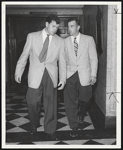 Talking Over the Missed Chances in last night's game against the Braves are Pitcher Robin Roberts, left, and Shortstop Granny Hamner of the Phillies, shown as they were leaving the Hotel Kenmore for a stroll this morning.