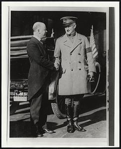 Mayor Andrew J. Peters greets Gen. Clarence R. Edwards in Copley Square at the end of the war. A big parade honored the troops returning from France.