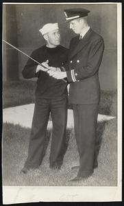 Gob Telling a Lieutenant?-Well, it’s understandable, because the sailor is Paul Runyan (left) , twice former PGA champion, and he’s merely telling Lt. (jg) John Fischer, former national amateur golf champion, how he likes to grip the club, during an off moment at the Norfolk, Va., Naval base where both are stationed.