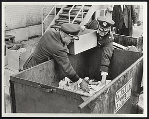 Thousands of draft registration cards and notices are retrieved from trash receptacle at Copley Square by Col. John Hurley, left, and Maj. Walter Cavanaugh of Massachusetts National Guard.