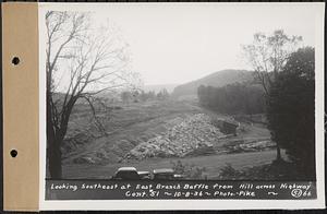 Contract No. 51, East Branch Baffle, Site of Quabbin Reservoir, Greenwich, Hardwick, looking southeast at east branch baffle from hill across highway, Hardwick, Mass., Oct. 8, 1936