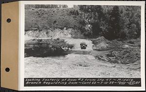 Contract No. 66, Regulating Dams, Middle Branch (New Salem), and East Branch of the Swift River, Hardwick and Petersham (formerly Dana), looking easterly at dam 3 from Sta. 47, middle branch regulating dam, Hardwick, Mass., Jul. 10, 1939