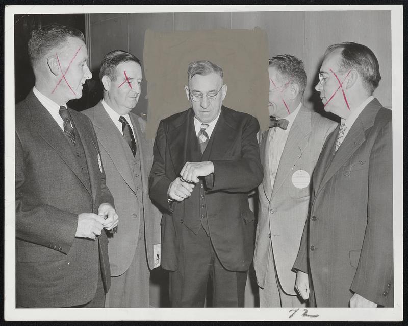 Former Stars Honor Jack Ryder (center), track coach emeritus at Boston College, who shows his greatest relay team the way he checked the watch when they broke the world record at the Penn Relays in 1924. Left to right, William McKillop, Tom Covanaugh, Ryder, Louis Welch and Pat Mahoney. Occasion was testimonial communion breakfast for the great coach at Boston College.