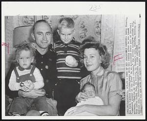 Four of His Staunchest Rooters - Bobby Shantz, New York Yankees pitcher, poses with his family after he was named "comeback player of the year" in an Associated Press poll of baseball wirters. "They're my biggest rooters," the little southpaw points out. From left- Kathy Ann, 2; Robbie, 4; Shantz's wife, Shirley, holding 16-day-old son, Teddy.