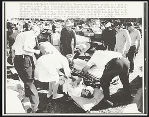 Nurses and firemen attend to a patient that was injured when a building collapsed on patients and hospital workers at the Veterans Administration Hospital during an earthquake that struck the Southern California area. Early reports stated that seven patients had been killed at the hospital, but rescue workers were looking for a large number of people reported trapped under the wreckage.