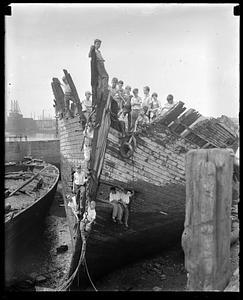 A group of boys on the remains of a ship