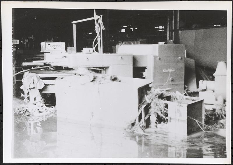 Flood damaged industrial machinery inside a factory environment