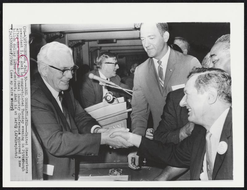 Abel Congratulated-- United Steelworkers president I.W. Abel is congratulated Tuesday evening in Pittsburgh after the union's Basic Steel Industry Conference approved a new billion dollar labor contract. Abel is at left.