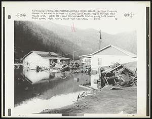 Buffalo Creek Valley; W. VA.: Property damage is extensive in wake of flash flood which ripped through this valley 2/26. Color Key: sand (foreground), bluish gray; left house, light green; right house, white with tan trim.