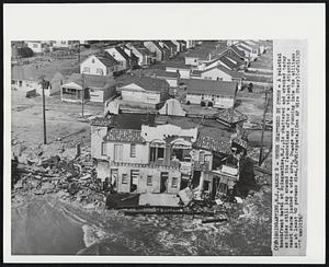 House Shattered by Storm - A palatial beachfront hotel at Brigantine, N.J., is shattered and wrecked today as tides still lap around its foundations after a violent Atlantic coast storm lashed a wide area. Damage was running into the millions as at least 40 persons died.