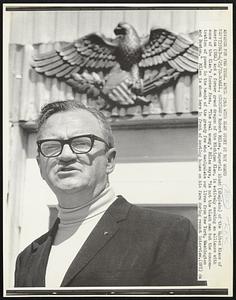 Robert Miles, imperial kludd (chaplain) of the United Klans of America (UKA) and a former grand dragon of the Michigan Klan, is actively seeking an alliance with some of the Klan's former foes. "The real enemy," Miles says, "is not the black man but the concentration of power in the hands of the greedy few who manipulate our lives from New York, Washington and Boston." Miles is shown here in front of meeting house on his farm during recent interview.