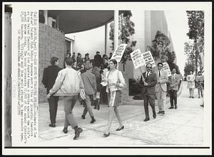 Los Angeles Teachers Strike--Students at Los Angeles' Belmont High School squeeze past a line of picketing teachers as the United Teachers of Los Angeles began a strike against the city's school system today. The union represents 22,000 of the school district's 25,000 teachers. Officials said they would attempt to keep schools open.