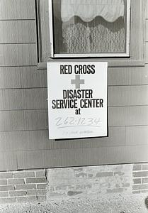 Red Cross placard affixed to one of the fire buildings