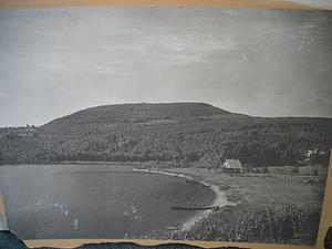 Black and white photo of a lake and mountain