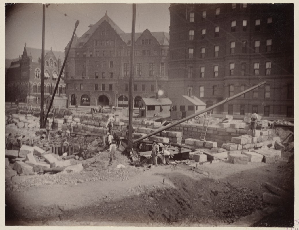 Laying granite blocks for foundation, construction of the McKim Building