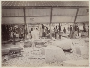 Workmen preparing granite blocks at Milford Quarry for use in construction of the McKim Building