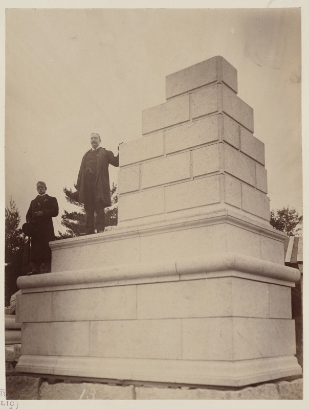 Members of the Trustees of the Boston Public Library and Boston City Council pose with mock-up of cornerstone for McKim Building assembled at the Milford Quarry