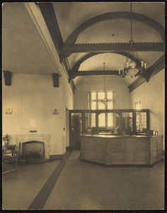 Interior of the Waban Branch Library showing circulation desk and fireplace