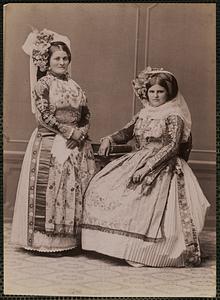 Studio portrait of two women in traditional Greek dress