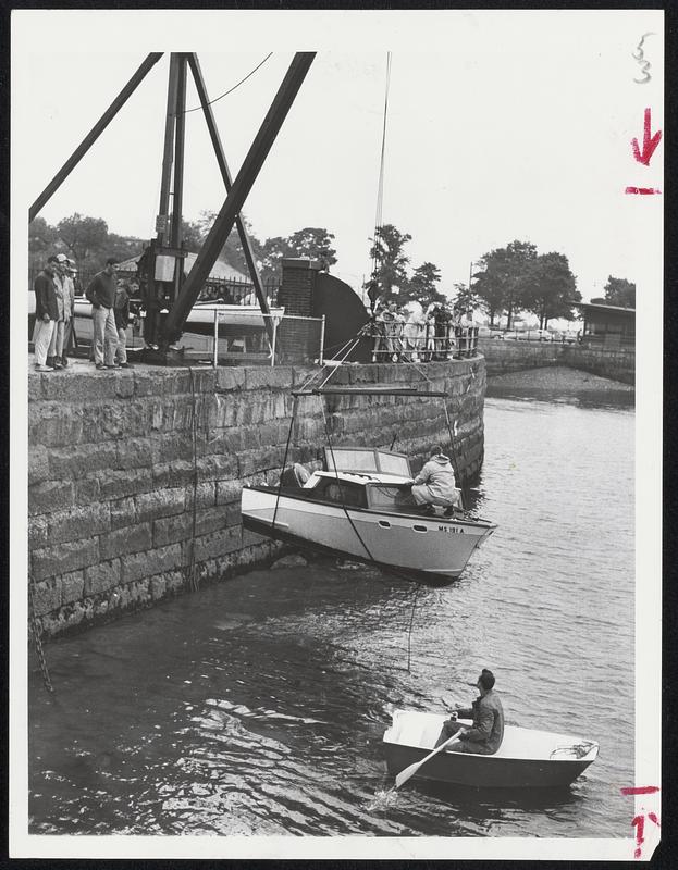 Cabin Cruiser "Why Not," owned by Terry Genz of Roslindale, is lifted out of the water at the South Boston Yacht Club, in preparation for Hurricane "Donna."