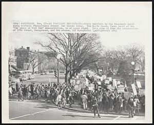 As Thousands Demonstrate--Peace marchers by the thousands march along historic Pennsylvania Avenue for blocks today. The White House, focal point of the "for peace in Vietnam" demonstration, is at upper right. This view is from the intersection of 17th Street, foreground, and the avenue.