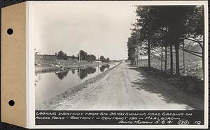 Contract No. 130, Grading, Loaming, and Grassing Vicinity of Shaft 4, Pressure Aqueduct, Southborough, and Improvement of Access Roads to the Intake Works and at Norumbega Reservoir, Marlborough, Southborough, Weston, looking westerly from Station 36+00 showing road grading on access road, Section 1, Marlborough, Mass., May 6, 1941