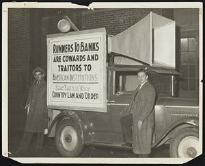 An advertising truck driven to various banks in the city yesterday and parked while music from its loudspeaker attracted passers-by to the signs encouraging faith in banks. The scheme was that of a Roxbury theatre.