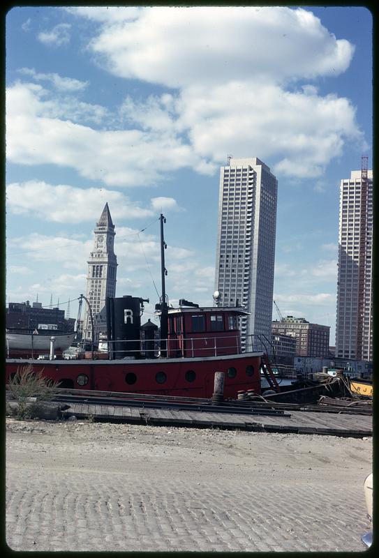 Custom House Tower and Harbor Towers, boat in foreground