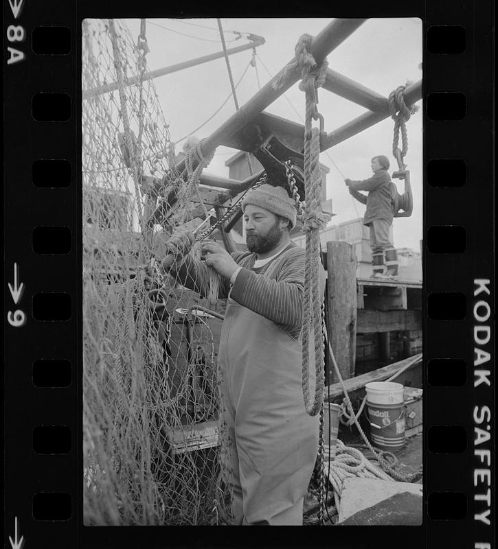 Fisherman fixing a net