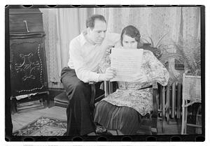 John and Maude Sanromá looking at a musical score