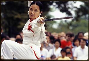 Boston - Hatch Shell: A dancer holds a sword during a performance, Dragon Boat Fest 1982