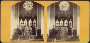 Interior view of a church decorated with flowers