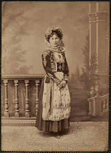 Studio portrait of woman in traditional Greek dress