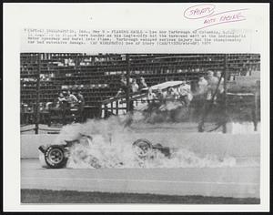 Flaming Eagle - Lee Roy Yarbrough of Columbia, S.C., is engulfed by flames here Sunday as his Eagle-Offy hit the turn-one wall at the Indianapolis Motor Speedway and burst into flame. Yarbrough escaped serious injury but the championship car had extensive damage.