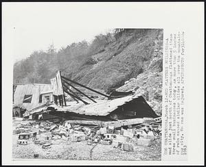 Mud Flattens Buildings-A base mud slide just north of Chattanooga flattened these three small businesses today, as more than 5 inches of rain caused similar slides all over the mountainous city. No one was injured.