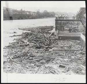 Log Jam -- Tons of debris, ripped from the banks of the Schuylkill river by torrential rains accompanying the passing of Hurricane Connie through Pennsylvania.