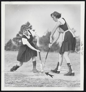 Natalie Harlow of Orange, Conn., (at left) has a close brush with opposing player as she scores a goal.