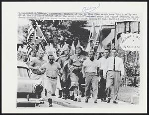 Members of the Ku Klux Clan march here 7/4. A rally was held at the old Slave Market after the march, which included about 208 "Klan" members. No incidents occurred, and the group broke up after a short speech by Rev. Connie Lynch.