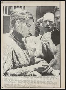Burns Husband's Draft Card--Nine women set fire to what they said were draft cards of nine men Wednesday on the steps of San Francisco's federal building. Here Carole Van Aelstyn, 28, mother of four children, burns what she said was draft card of her husband, Edward A. Van Aelstyn, 32, an English professor at San Francisco State. A group calling itself The Resistance staged the card burning rally in support of Dr. Benjamin Spock and three co-defendants who were sentenced in Boston for aiding young men to avoid the draft.