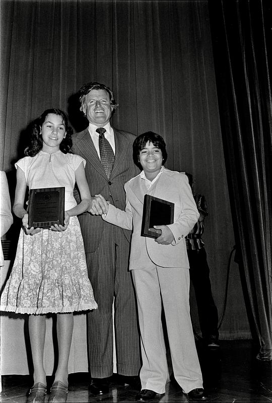 Lucas Rodriquez and unidentified girl receive science awards from Senator Ted Kennedy