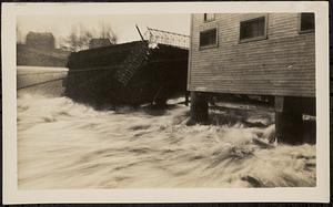 Main Street bridge being swept away