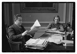 A man seated at a desk