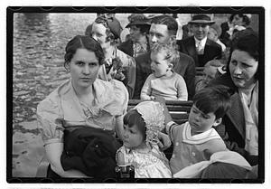 People on a swan boat including Maude Sanromá