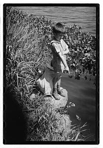 Children by a body of water