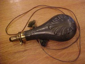 Decorated powder flask with cord